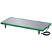 A green and silver rectangular Hatco heated shelf on a table with a cord.