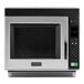 A silver and black Amana commercial microwave.