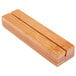 An American Metalcraft natural bamboo block with two parallel sides and two slots.