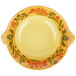 A yellow melamine bowl with a floral design on it.
