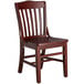 A Lancaster Table & Seating mahogany wood school house chair with a dark brown finish.