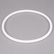 A white plastic ring with a white circle on a gray background.