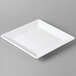 A white square Cal-Mil melamine platter on a gray surface.