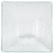 A clear acrylic square bowl with a diamond pattern on the bottom.