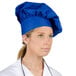 A woman wearing a Choice royal blue chef hat.