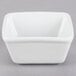 A white square Tuxton ramekin.