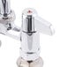 A chrome Equip by T&S deck mount faucet with two handles.