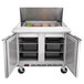 A Beverage-Air stainless steel refrigerated sandwich prep table with two trays inside.