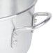 A close-up of a silver aluminum steamer water pan.