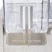 A close up of a Crathco stainless steel cold beverage dispenser on a counter.