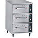 A Hatco narrow three drawer warmer with a stainless steel top.