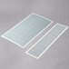 Two white rectangular Curtron insect trap glue boards with grid lines.