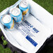 A cooler bag with Polar Tech Foam Freeze Packs and cans inside.