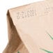 A brown bag with green text that reads "Agricor Coarse Yellow Cornmeal"
