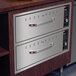 A Hatco freestanding two drawer warmer on a counter.