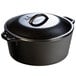 A Lodge black cast iron dutch oven with a lid.