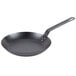 A Lodge carbon steel frying pan with a handle.