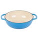 A Caribbean blue and white enameled cast iron pot with two handles.