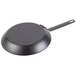 A close-up of a Lodge carbon steel frying pan with a handle.
