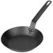 A Lodge CRS8 carbon steel fry pan with a handle.