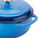A Caribbean blue Lodge enameled cast iron Dutch oven with a lid.