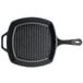 A Lodge pre-seasoned cast iron square grill pan with a handle.
