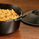 A Lodge Pro-Logic cast iron pot of macaroni and cheese.