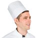 A man wearing a Chef Revival pinstripe chef hat.
