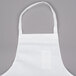 A white Chef Revival bib apron with a pocket.