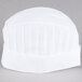 A white Chef Revival disposable non-woven chef hat with pleats.