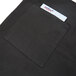A black apron with a black pocket and white card inside.