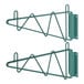 A pair of green Regency wall mounting brackets with hooks.