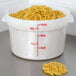 A white Cambro food storage container with noodles in it.