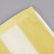 An Oxford yellow and white striped pool towel.