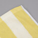A yellow and white striped Oxford pool towel.