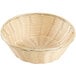 A round natural-colored rattan bread basket with a handle.