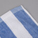 An Oxford blue and white striped pool towel.