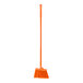 A close up of a Carlisle commercial broom with orange flagged bristles and a 48" handle.