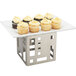 A tray of cupcakes on a Cal-Mil stainless steel cube riser.