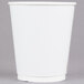 A case of Sabert white double-wall paper hot cups with a lid.