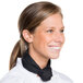 A smiling woman wearing a black Chef Revival neck scarf.