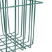 A green Metro wire storage basket with a handle.