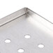 A stainless steel Nemco reservoir lid with holes in it.