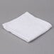 An Oxford Gold white cotton/poly wash cloth with a hemmed cam border.
