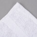 A white Oxford Regale wash cloth with a white border.