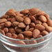 A glass bowl of Blue Diamond roasted salted almonds.