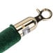 A green velvet Aarco rope with brass ends.