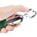 A person holding a green Aarco rope with chrome ends.