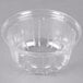 A clear plastic high dome lid on a clear plastic bowl.