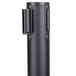 A black metal Aarco crowd control stanchion cylinder with a black handle.